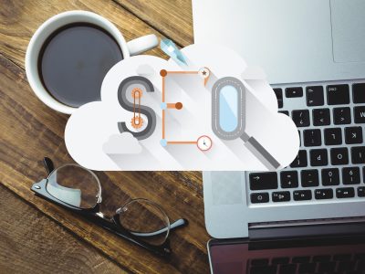 digital composite of coffee with laptop and SEO graphics